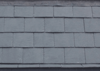 Evenly laid grey slate roof tiles showing a consistent overlapping pattern and clean horizontal lines.